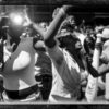 Fans of Yung Jock scream and tossle for attention for the well known rapper as he rode by on the WGCI Radio Station's float in the annual Bud Billiken Parade in 2006.