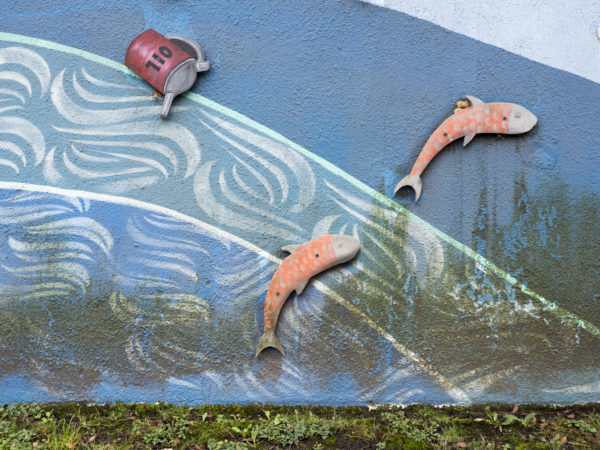 A mural depicts oil pollution.