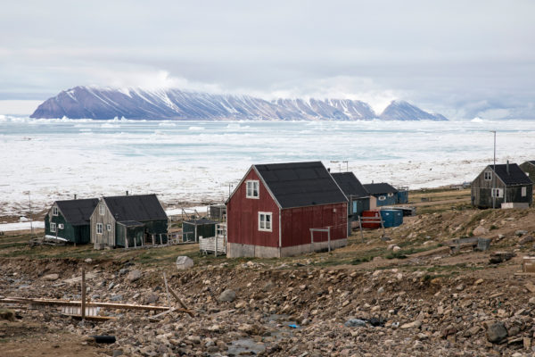 Homes along the sea in Qaanaaq, Greenland, photographed by Anna Filipova.
